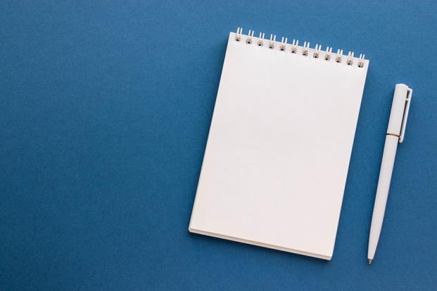 4 Secrets to Retiring Happy from Military.com’s Longtime Financial Columnist White notebook and pen.